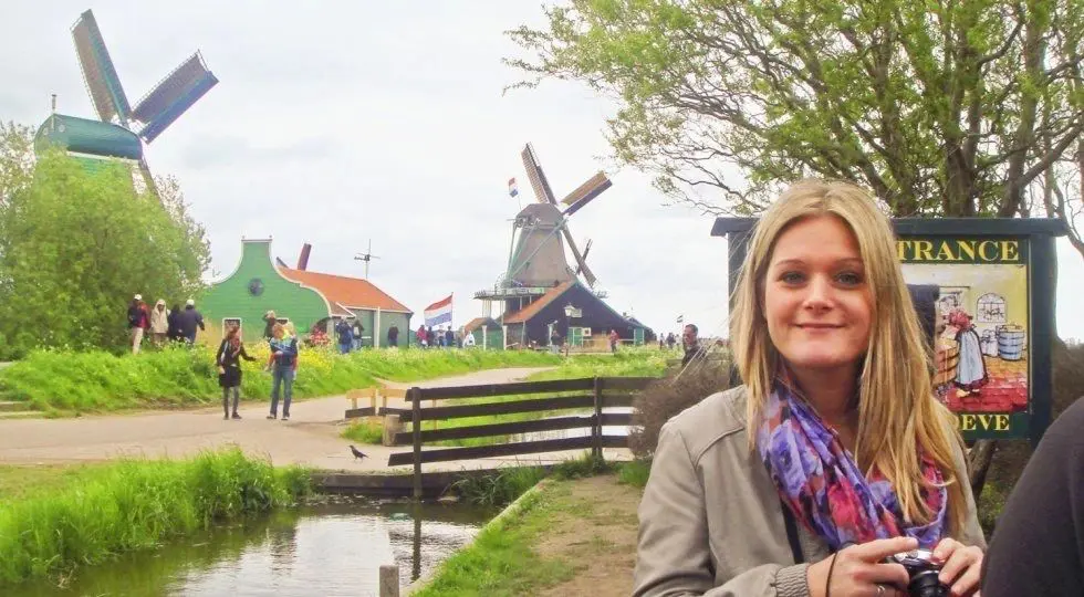 Woman tourist at Zaanse Schans windmills.