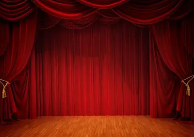 Red velvet theater stage curtains.