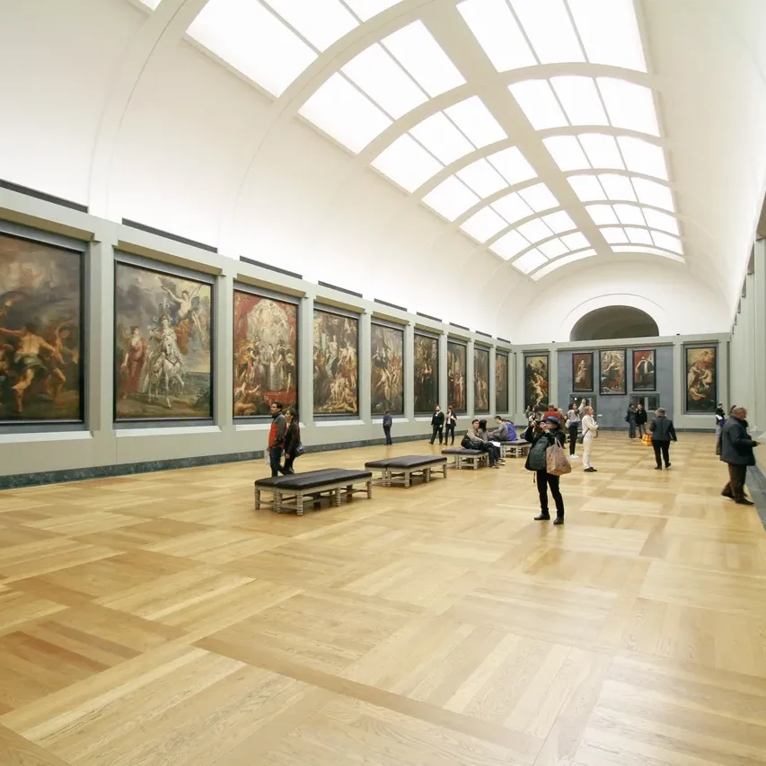 Museum gallery with large paintings.